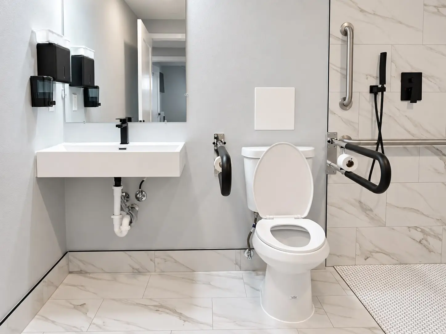 Bathroom with a wall-mounted sink and fold-down grab bars