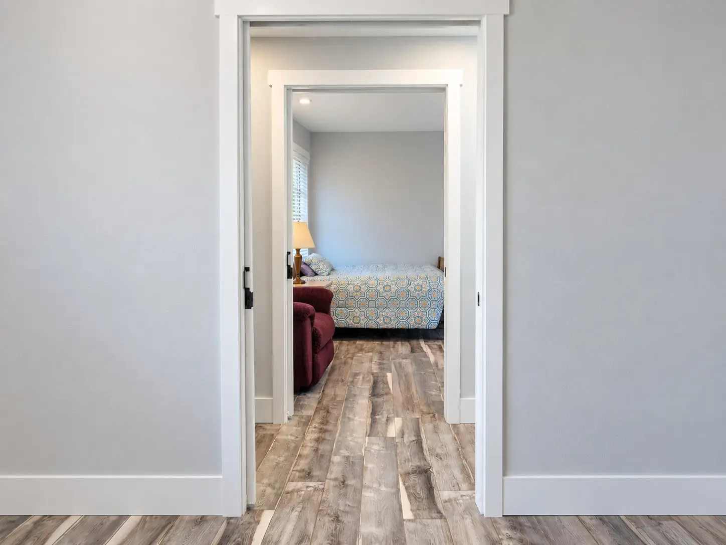 View through a doorway into a bedroom